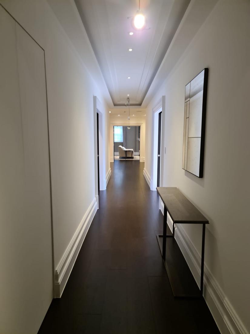 Long hallway with dark floor