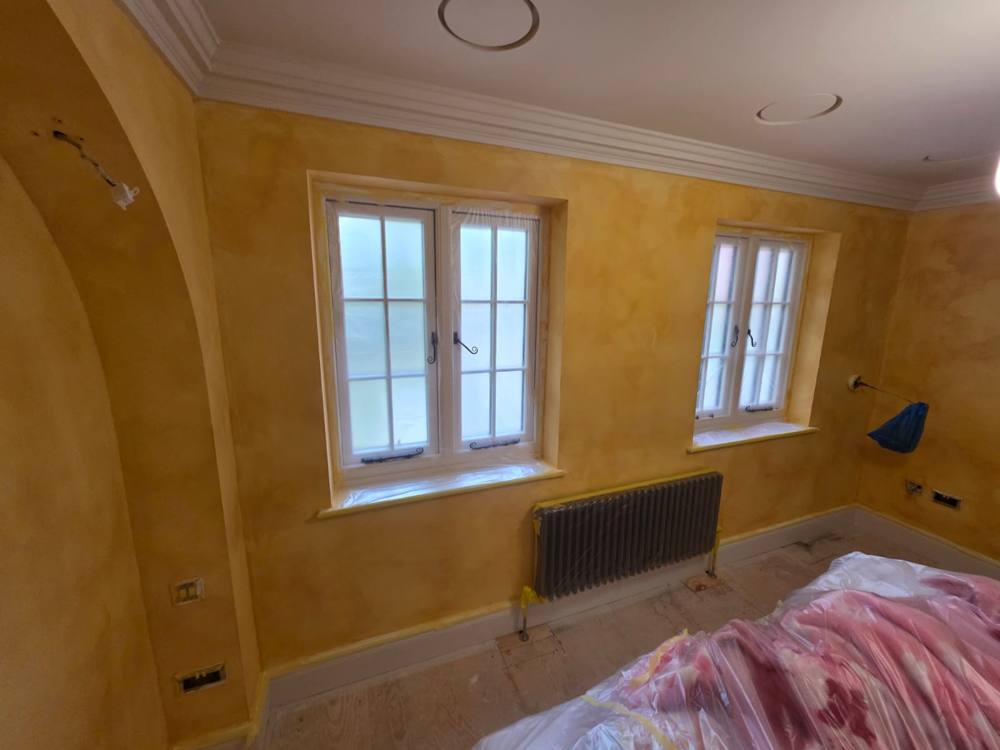 Bedroom with warm golden limewash walls